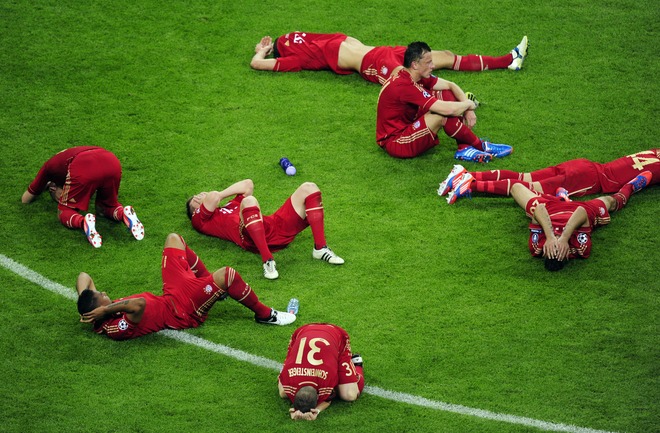 Players Of Bayern Munich Lay On The Pitch 